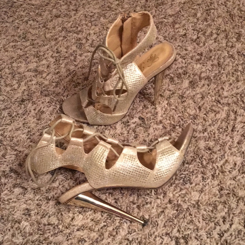 Gold lace up stilettos